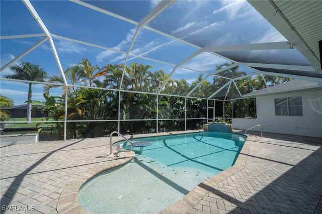 view of pool with a lanai and a patio area