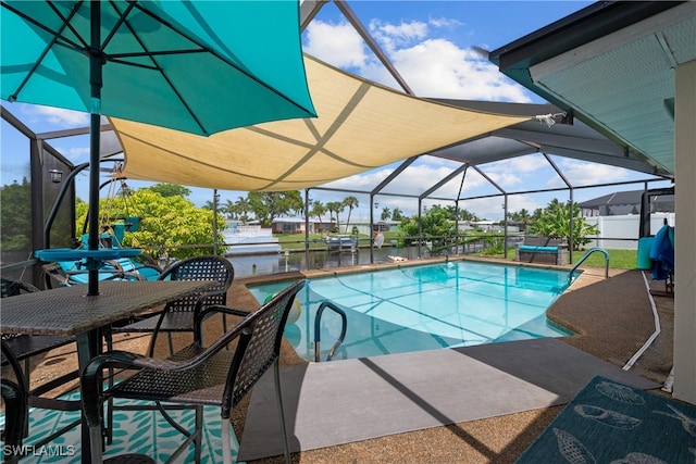 view of swimming pool with a water view, a lanai, and a patio area