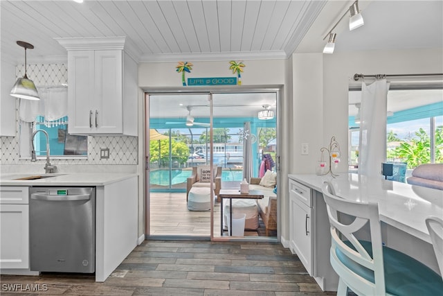 kitchen with dishwasher, sink, white cabinets, dark hardwood / wood-style flooring, and ornamental molding