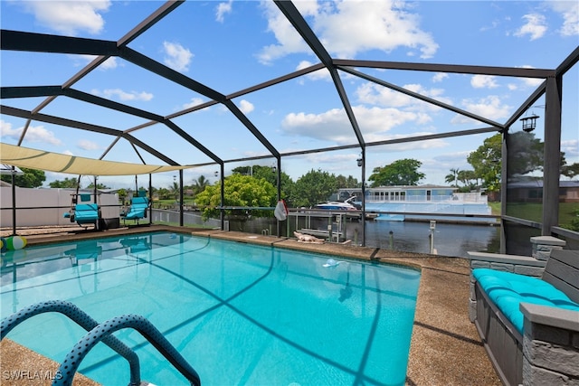 view of swimming pool featuring a lanai, a dock, and a water view