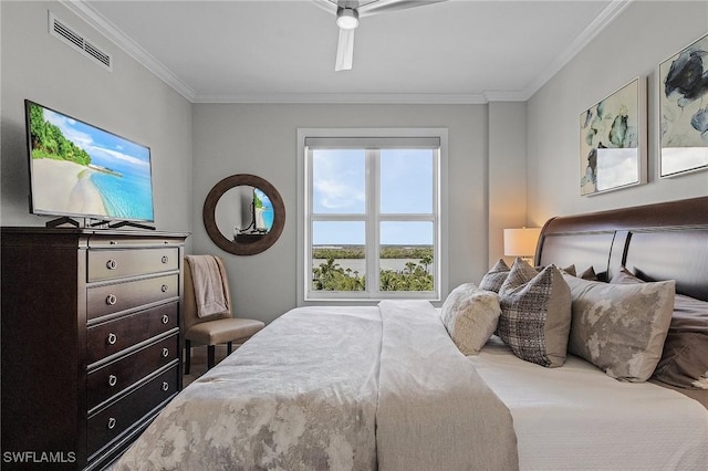 bedroom with ceiling fan and ornamental molding