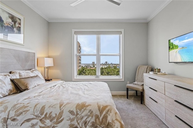 bedroom featuring ceiling fan, light colored carpet, and ornamental molding