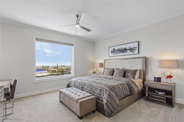 bedroom with ceiling fan, light colored carpet, and ornamental molding