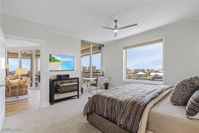 bedroom with ceiling fan, light colored carpet, and ornamental molding