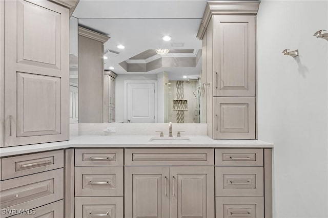 bathroom featuring vanity, ornamental molding, and walk in shower