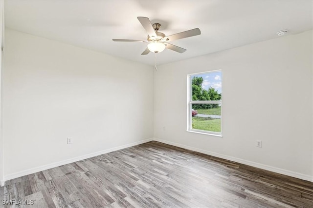 empty room featuring ceiling fan and light wood-type flooring