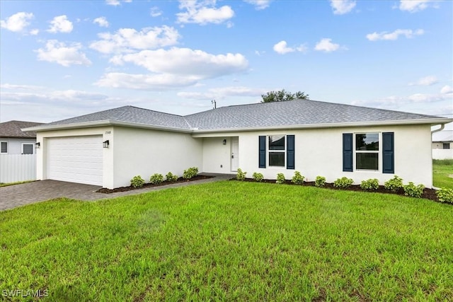 single story home with a garage and a front lawn