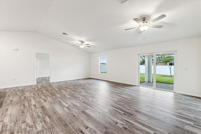 empty room with lofted ceiling, hardwood / wood-style floors, and ceiling fan