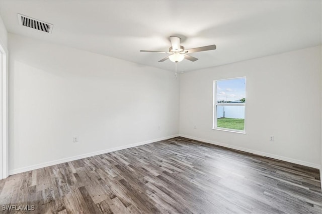 empty room featuring hardwood / wood-style floors and ceiling fan