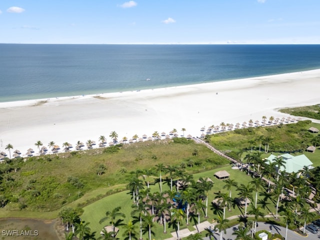 drone / aerial view with a water view and a beach view