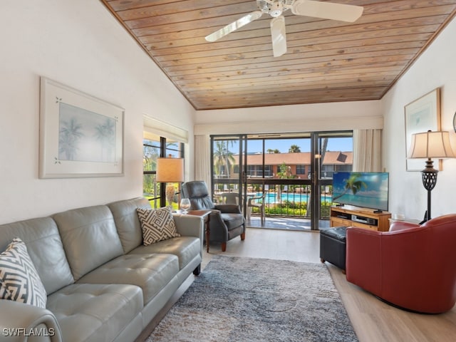 living room with lofted ceiling, light hardwood / wood-style floors, wood ceiling, and ceiling fan