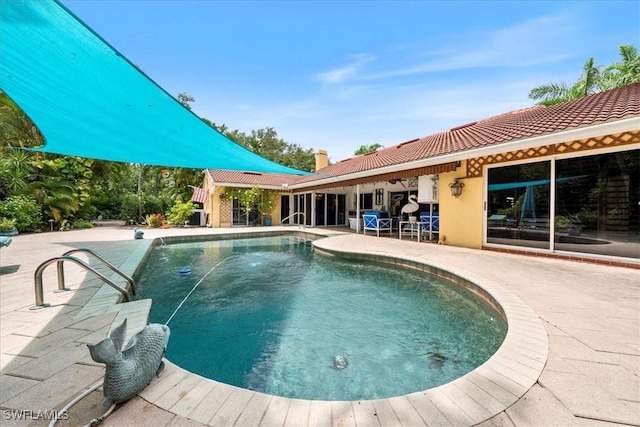 view of swimming pool featuring a patio area