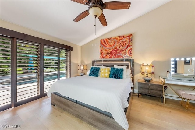 bedroom with ceiling fan, light hardwood / wood-style floors, lofted ceiling, and access to outside