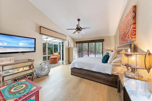 bedroom with light hardwood / wood-style flooring, ceiling fan, and lofted ceiling