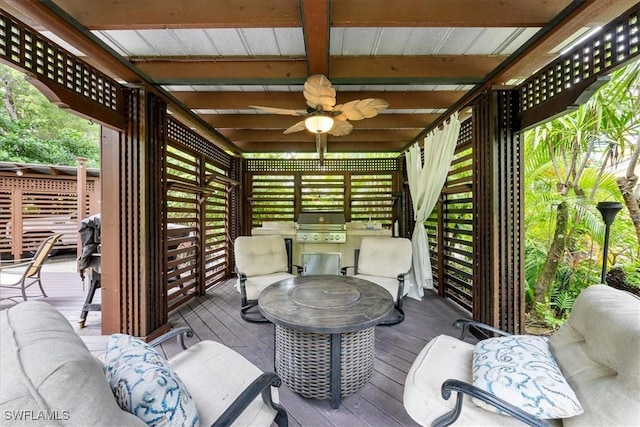 wooden terrace featuring area for grilling, ceiling fan, outdoor lounge area, and a grill