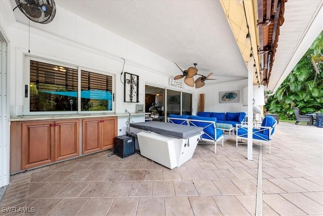 view of patio featuring outdoor lounge area and ceiling fan