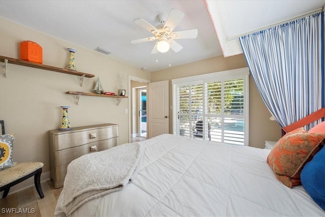 bedroom with hardwood / wood-style flooring and ceiling fan