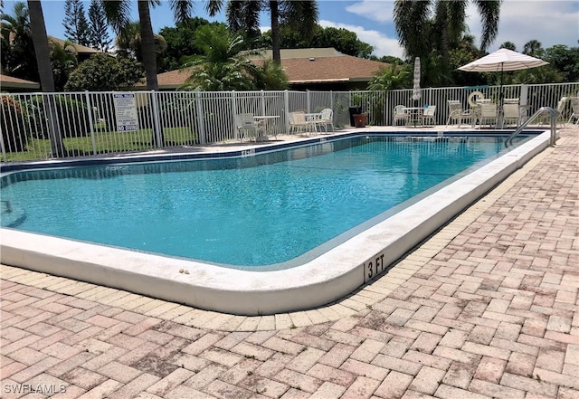 view of swimming pool featuring a patio