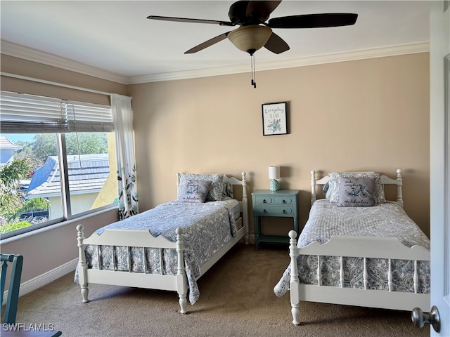 bedroom featuring ceiling fan, carpet floors, and crown molding