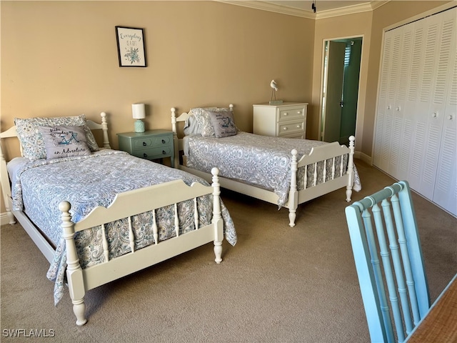 bedroom with a closet, carpet floors, and ornamental molding