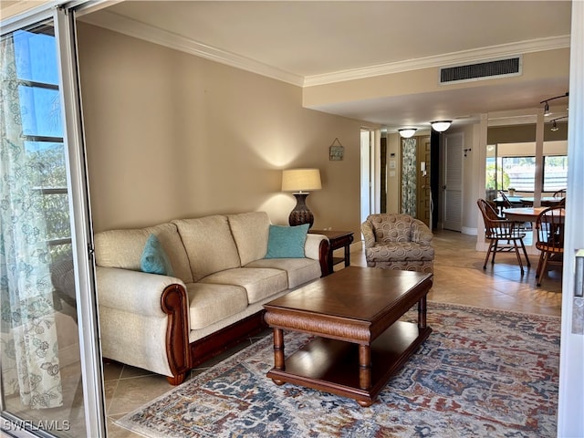 tiled living room featuring ornamental molding