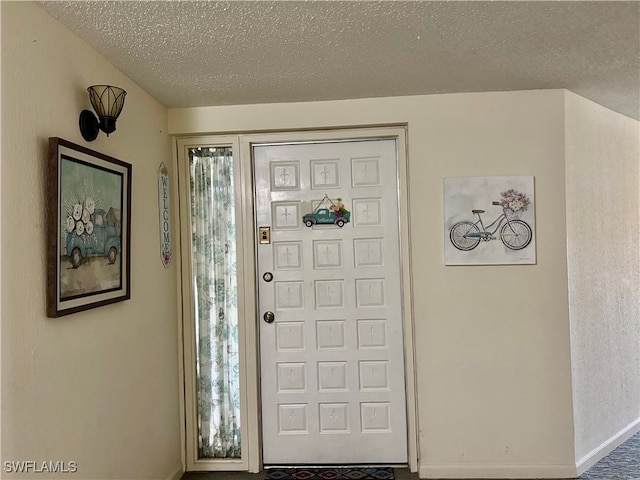 entrance foyer with a textured ceiling