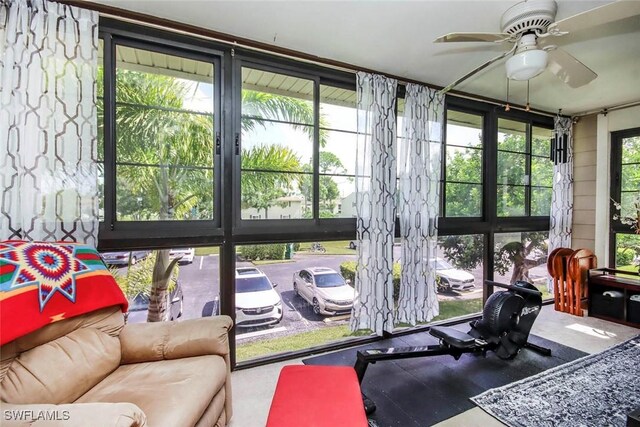 sunroom with ceiling fan