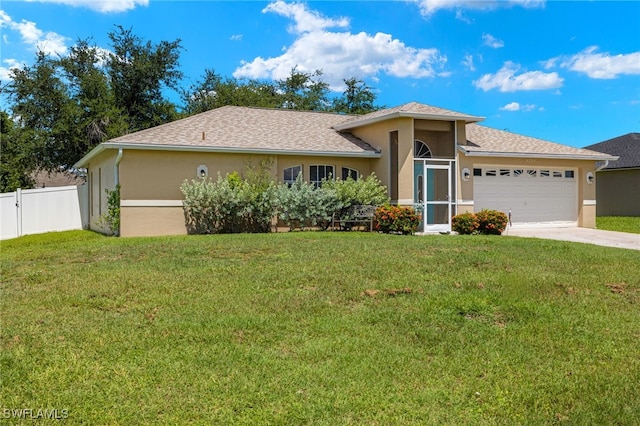 view of front of property featuring a garage, a front lawn, and stucco siding