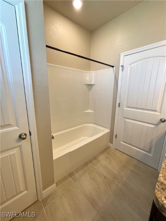 bathroom with shower / bathing tub combination and tile patterned flooring