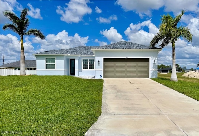 view of front of home with a garage and a front yard