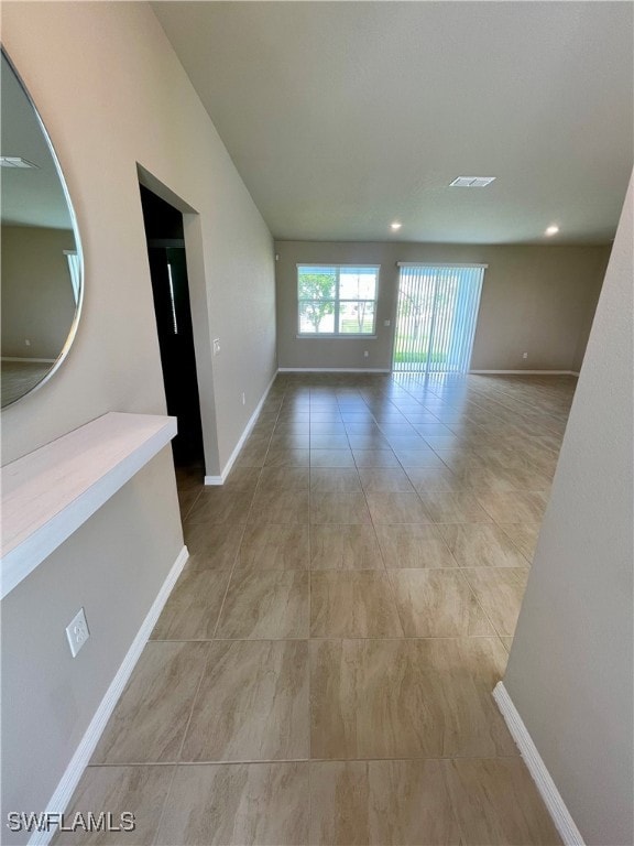 hallway featuring light tile patterned floors