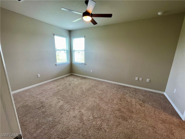 carpeted empty room with ceiling fan