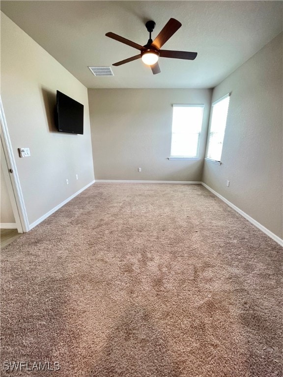 carpeted empty room with ceiling fan