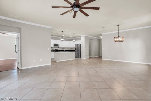 unfurnished living room with light tile patterned flooring, crown molding, and ceiling fan with notable chandelier