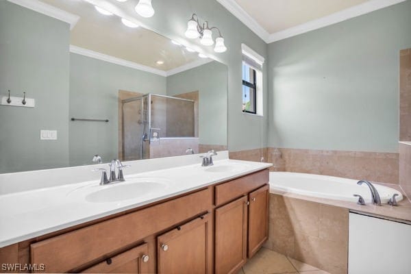 bathroom featuring ornamental molding, tile patterned floors, separate shower and tub, and dual bowl vanity