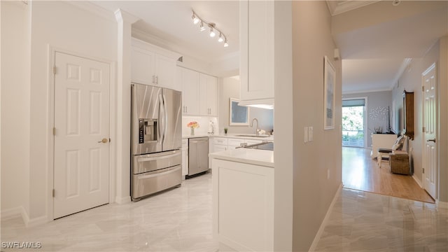 kitchen with crown molding, stainless steel appliances, sink, and white cabinets