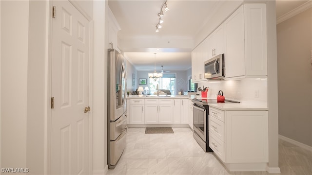 kitchen featuring an inviting chandelier, decorative light fixtures, stainless steel appliances, ornamental molding, and white cabinetry