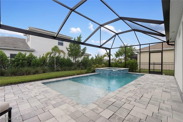 view of pool with a patio, a lanai, and a pool with connected hot tub