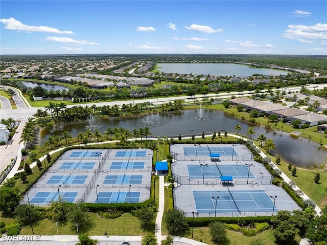 birds eye view of property featuring a water view and a residential view