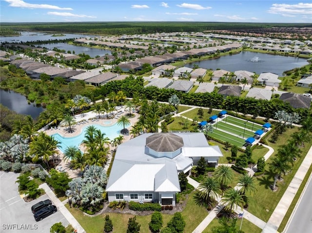 birds eye view of property featuring a water view and a residential view