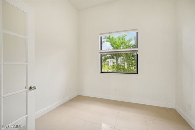 spare room featuring light tile patterned floors