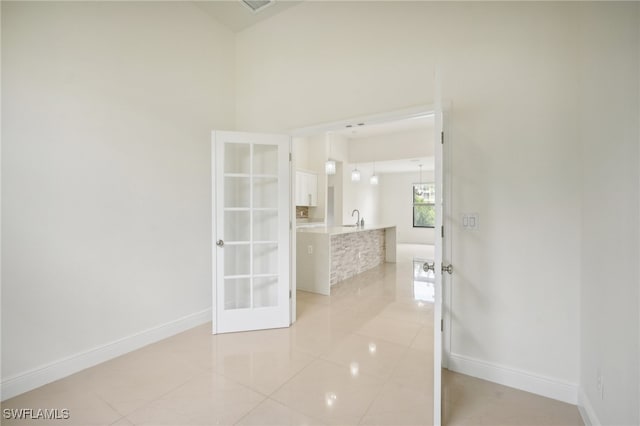 interior space featuring sink and light tile patterned floors