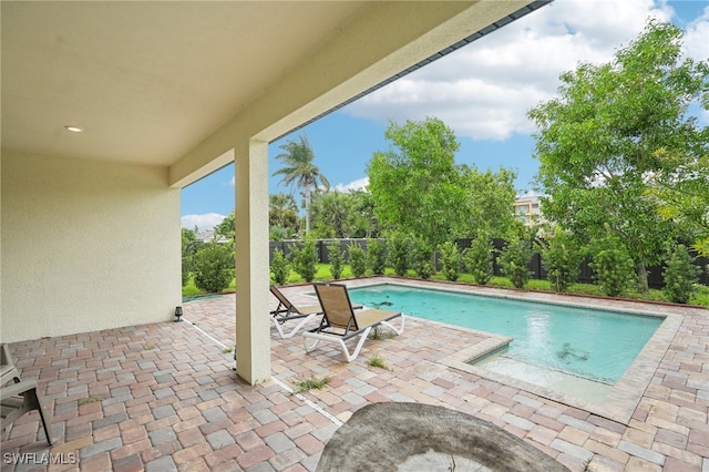 view of swimming pool with a patio