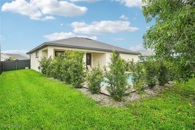 view of property exterior featuring a lawn