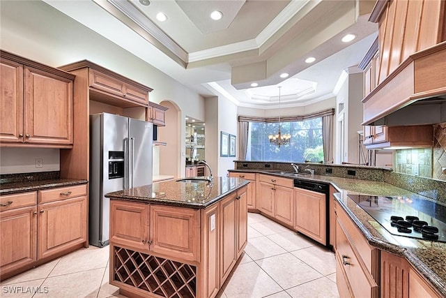 kitchen with dark stone countertops, black electric stovetop, paneled dishwasher, and high quality fridge