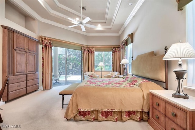 carpeted bedroom featuring crown molding, access to exterior, and a raised ceiling