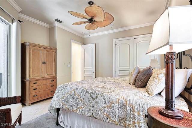 tiled bedroom featuring ornamental molding, a closet, and ceiling fan