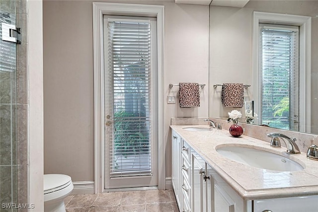 bathroom with tile patterned floors, vanity, and toilet