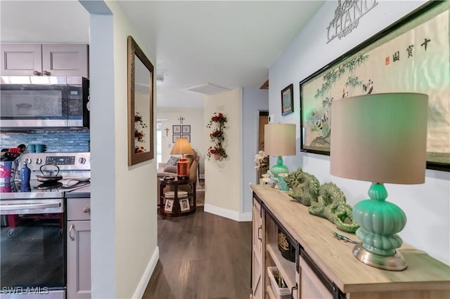 hall with dark hardwood / wood-style flooring