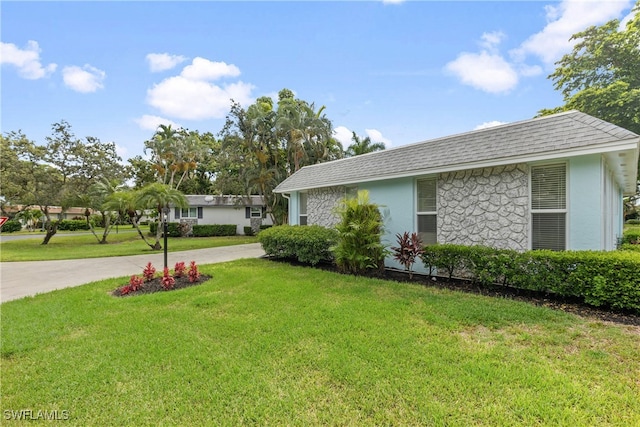 view of home's exterior with a yard